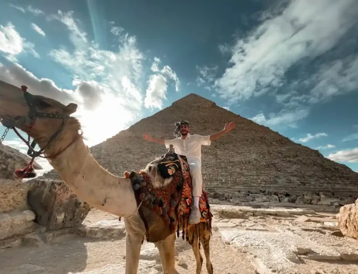 A luxury guided tour at the Giza Pyramids during sunset, managed by Voyage On The Spot, the premier Egypt tour company.