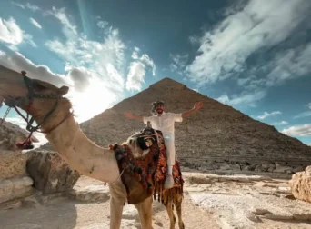 A luxury guided tour at the Giza Pyramids during sunset with camel riding, by Voyage On The Spot, Egypt.