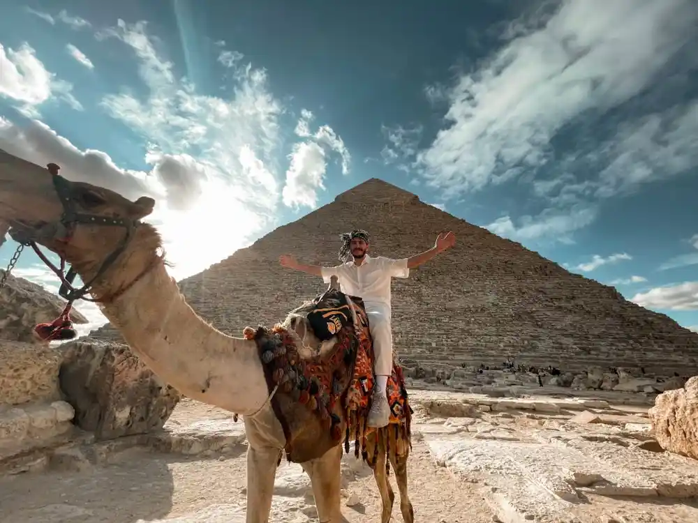 A luxury guided tour at the Giza Pyramids during sunset with camel riding, by Voyage On The Spot, Egypt.